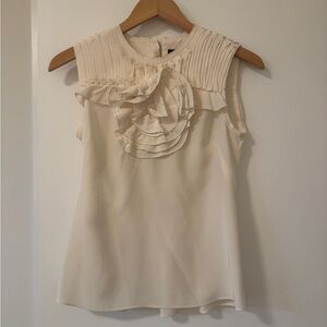 White sleeveless blouse
